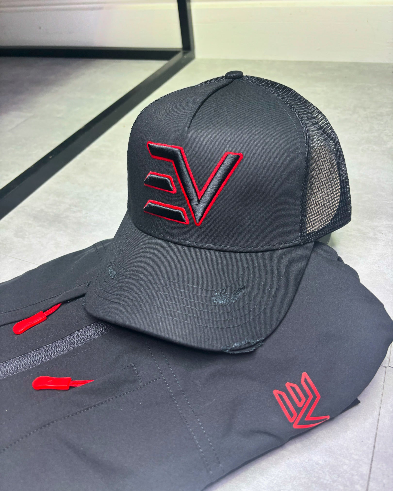 EV Logo Trucker Cap “Black/Red”