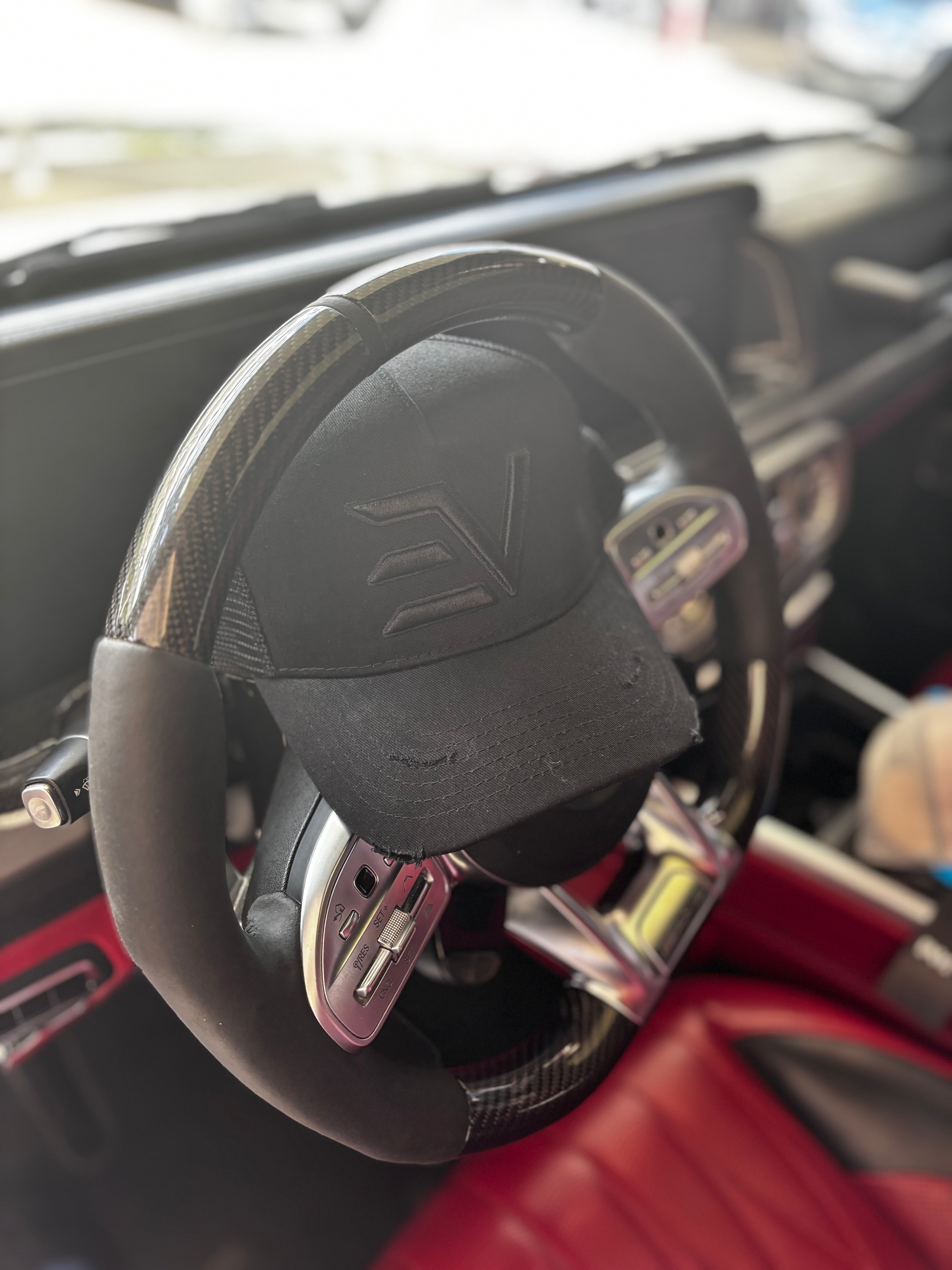 EV Logo Trucker Cap “Blacked Out”