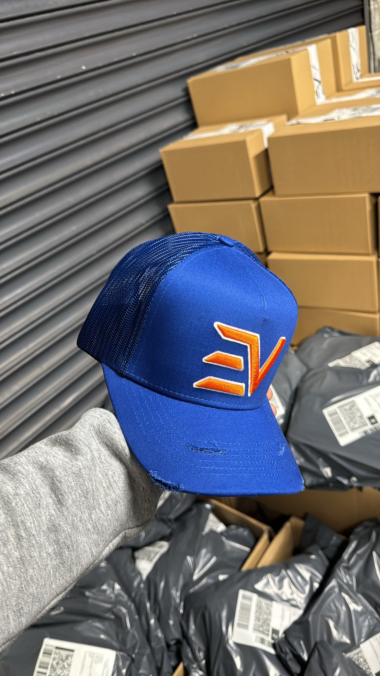 EV Logo Trucker Hat Royal Blue/Orange